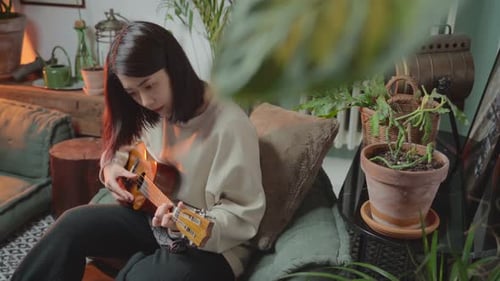Woman Playing Ukulele at Home, Cozy Scene