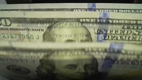 Counting One Hundred Dollar Bills in Money Counter