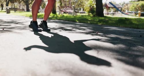 Feet, fitness and jump rope at park with workout for wellness, balance and weight loss with summer