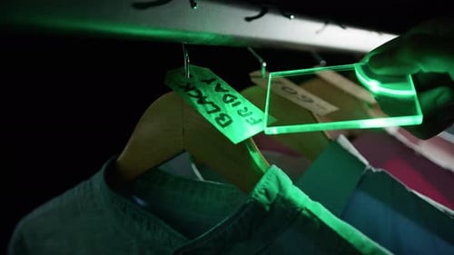 Shop Assistant Checking Discount Tags for Black Friday