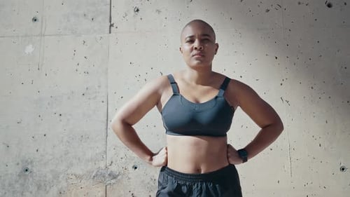shaved woman making sport outdoor.