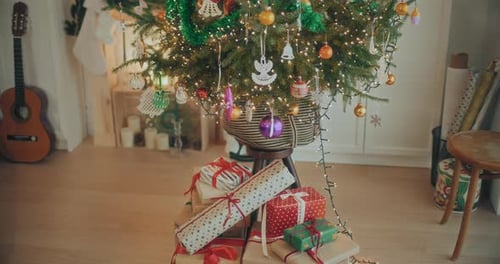 Festive Christmas Tree with Gifts in Bright Home