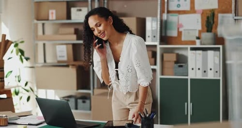Woman, talk and phone call on laptop at warehouse of stock inventory, online order and negotiation