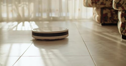 Robotic Vacuum Cleaner Cleaning Tiled Floor