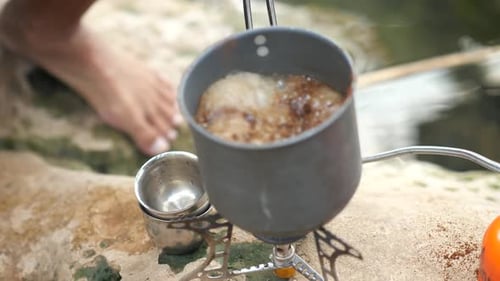 Making Coffee on Camping Stove by River
