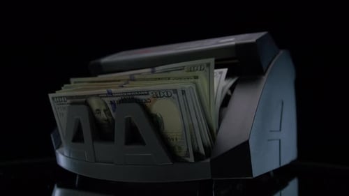 Money Counter Processing US Dollar Bills