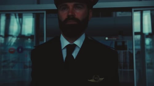 Handsome Blueeyed Bearded Caucasian Pilot Walks Out of the Airport Terminal Confidence Men s Power