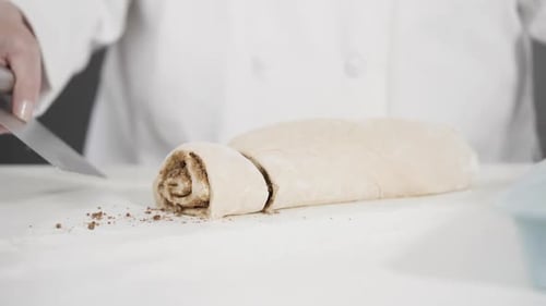 Unbaked Cinnamon Rolls in a Blue Baking Pan