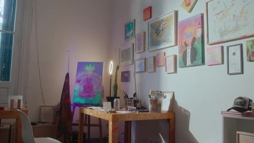 Art Studio with Workplace, Painting Supplies and Artworks