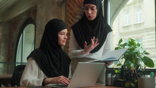 Women in Hijabs Working in Modern Office