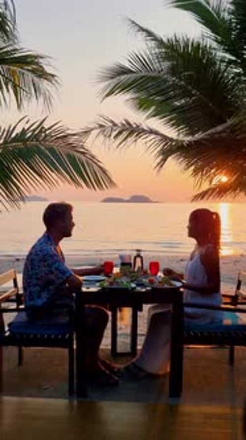 Romantic Dinner on the Beach During Sunset in Thailand at Vacation on the Island of Koh Chang