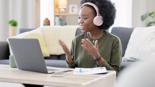 Woman Video Chats on Laptop at Home