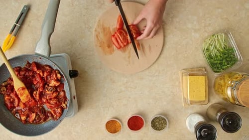Preparing Pasta Sauce with Fresh Tomatoes and Spices