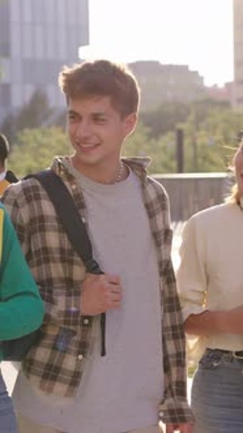 Students Walking and Talking Outdoors on a Sunny Day