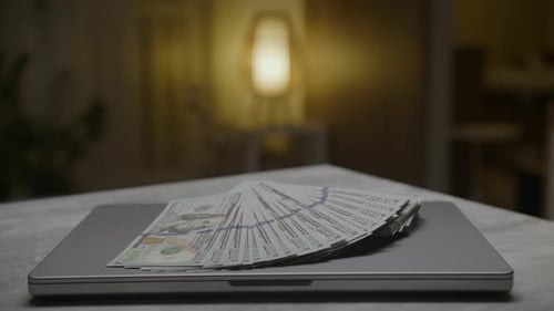 Money on a Laptop Computer at Home