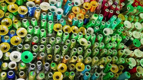Vibrant Display of Colorful Spools of Thread