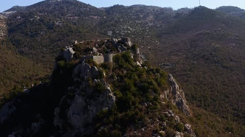 aerial shot of the castle on the top of the mountain. 4K. ancient castle ruin.
