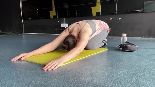 Young fit women doing yoga doing asanas in bright yoga studios, yoga a form of physical relaxation,