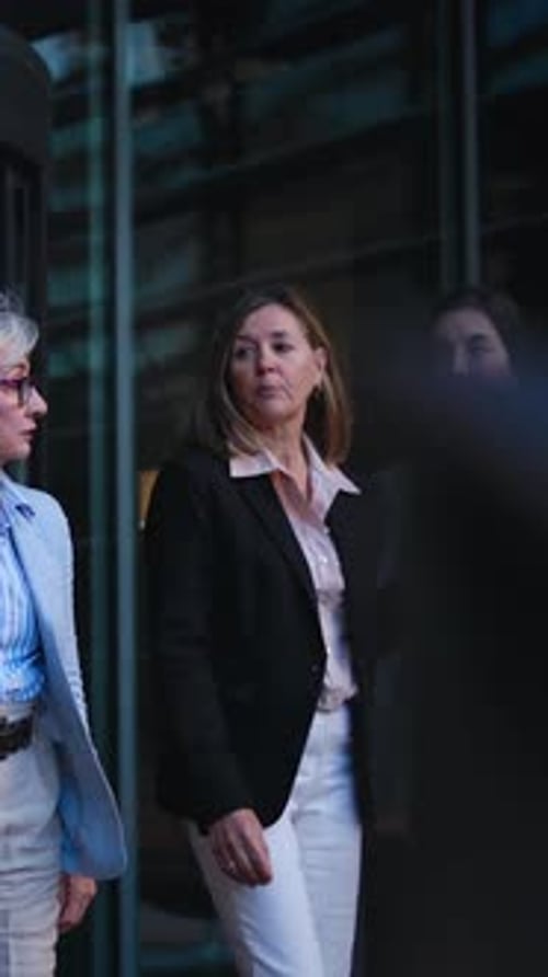 Three Women Walking Outside of Office Building