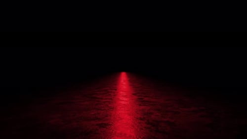 Red light beam shining on dark concrete floor