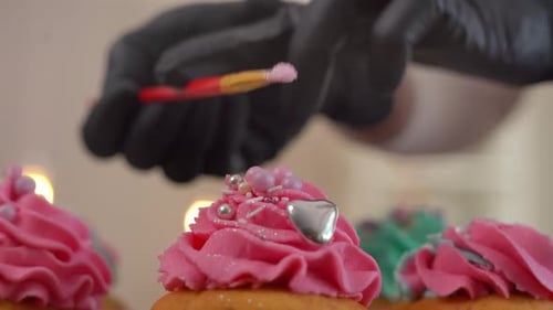 Decorating Cupcakes with Pink Frosting and Glitter