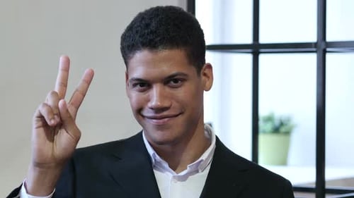 Victory Sign By Black Businessman