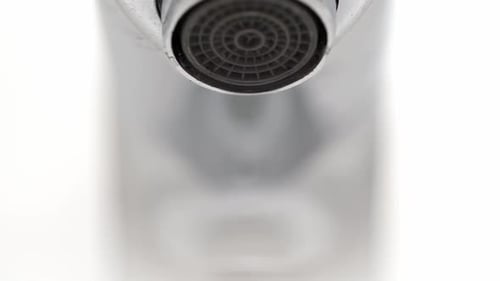 Water Leaking From Faucet Closeup
