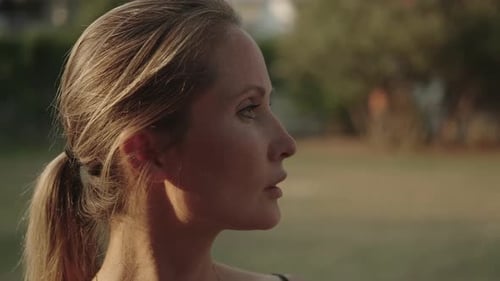 Woman Standing Outside in the Golden Evening Light