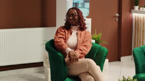 Guest Sitting in Welcoming Hotel Lounge