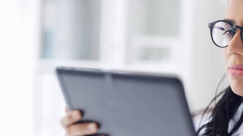 Female doctor using tablet computer in hospital medical office healthcare concept