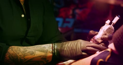 Milan/Italy-01.02.2019:Slow motion of professional master of the art of tattooing doing a tattoo t