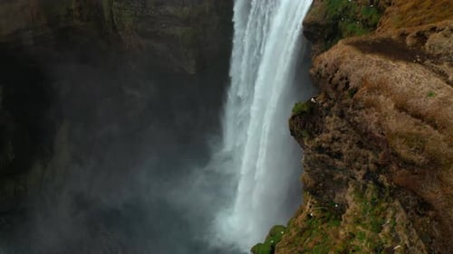 Revealing shot of Skogafoss waterfall in Iceland