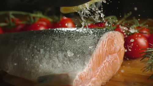 Lemon Juice Squeezed onto Fresh Salmon Fillet