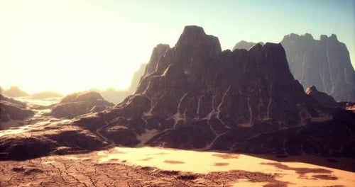 Majestic Desert Landscape at Sunrise Revealing Rugged Mountains and Dry Terrain