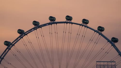 Timelapse of Clouds Passing Singapore Flyer Close Up in Singapore.