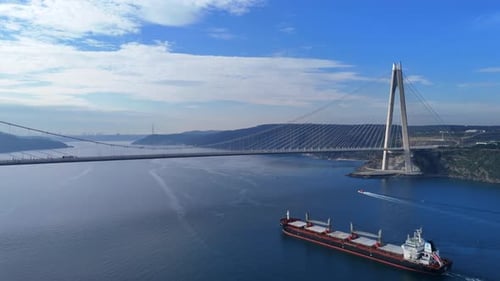 Cargo Ship Passing Under The Bridge