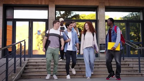 Happy Group Diverse Young Students Friends Walking Down the Stairs Leaving the University Building