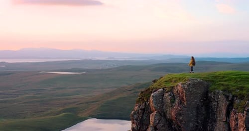 An unrecognizable woman enjoying the mountain views during her hike