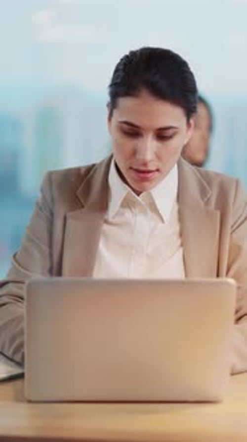Young Caucasian Office Executive Woman Using Laptop and Writing Work Project Designing Plan in