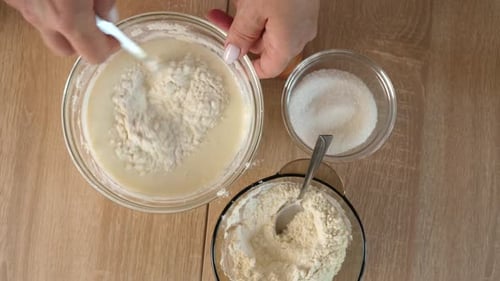 Mixing Cake Batter Ingredients in Bowl on Table