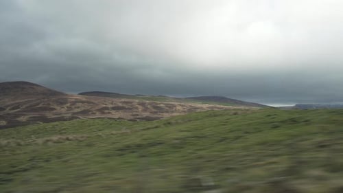 Rolling Hills Drive Through Green Rural Landscape