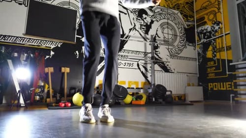 Legs of Young Sportsman Skipping with a Jump Rope at Sport Club Male Feet of Athlete Exercising in