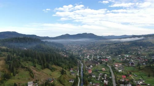 Wide Shot Picturesque Carpathian Mountains with Small Village in the Morning Aerial View Landscape