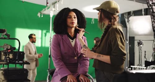 Makeup, beauty and cosmetologist with model in studio for photoshoot, filming or production