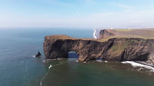 Aerial video over the cliffs of Dyrhulai, South Iceland