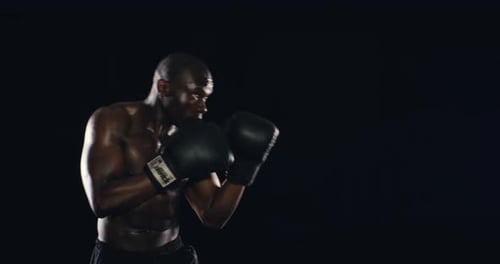 4k video footage of an athletic young man against a black background