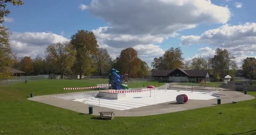 Closed empty water park and slides with splash areas recreational water play space shut down or aban