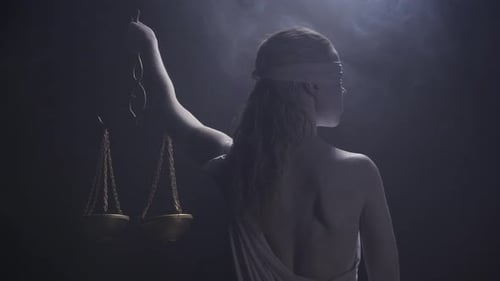 Close Up of the Living Statue of Themis with the Scales View From the Back