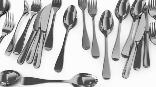Rotating Stainless Steel Cutlery Set on White Background