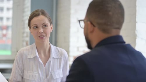 Close up of Woman Talking with Businessman